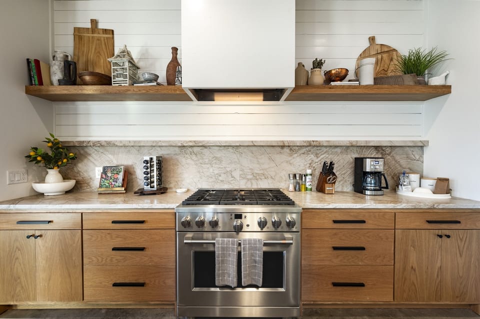 Kitchen: Culinary paradise awaits with sleek appliances and stunning marble countertops!