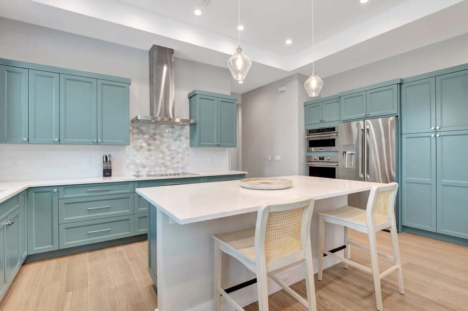 Prepare delicious meals in the high-end kitchen, equipped with stainless steel appliances and ample counter space for culinary adventures.
