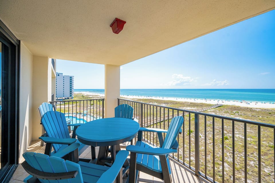 Relax on your balcony's chairs while soaking in the stunning views of the coast and enjoying the refreshing breeze