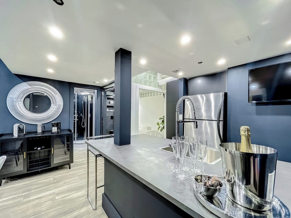 Entertain with big screens, a stone table for 12, and a fully-equipped kitchen