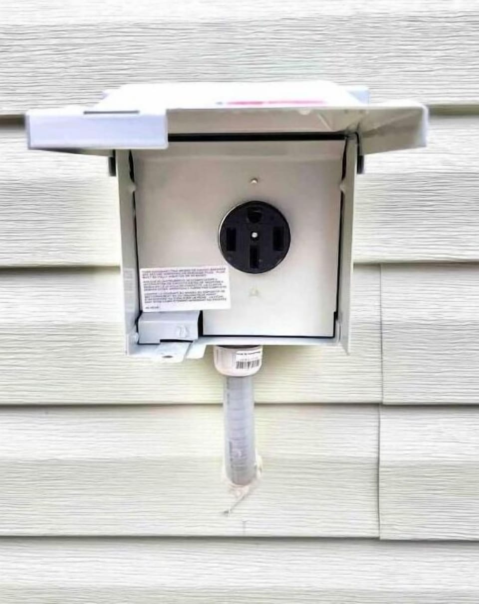 Bring your own mobile charger & hook up to our 220V NEMA 14-50 outlet.