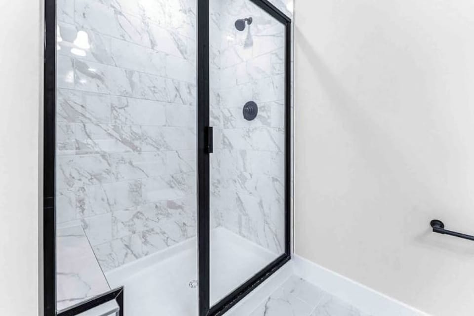 The en-suite bathroom in the primary suite offers a separate walk in shower.