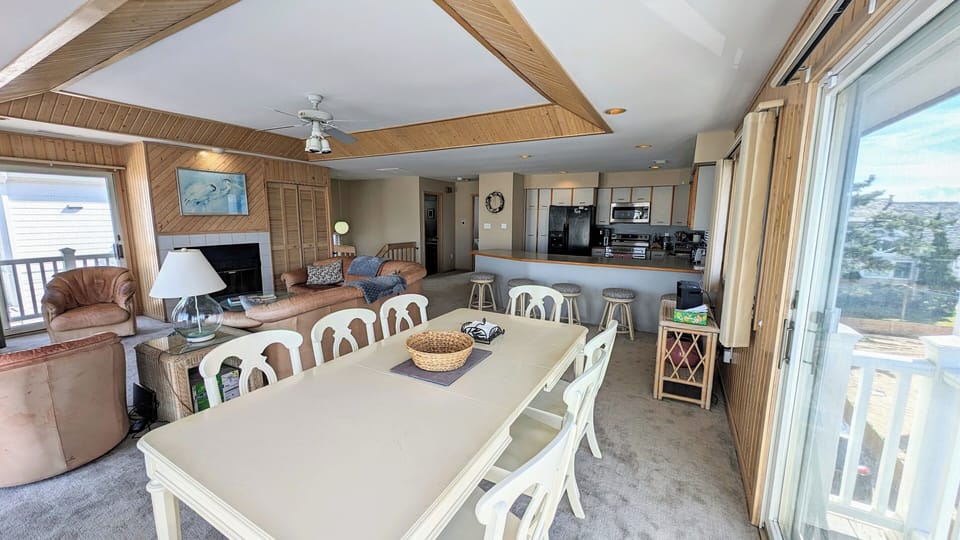 View from dining room toward seating area and kitchen