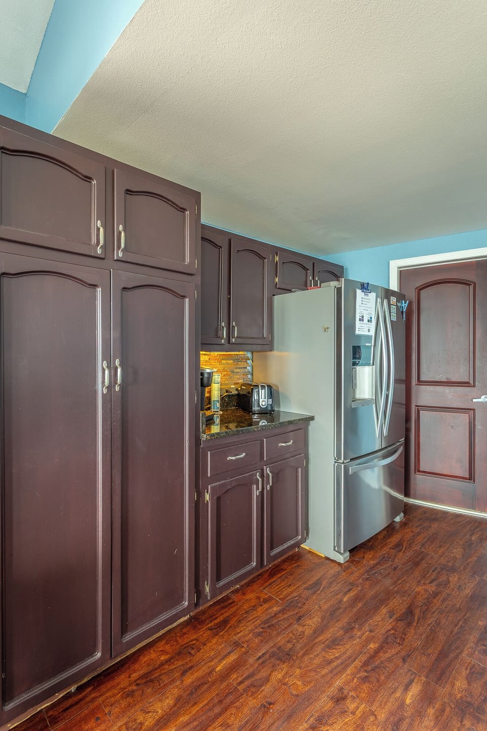 Kitchen With Door To Shared Bath