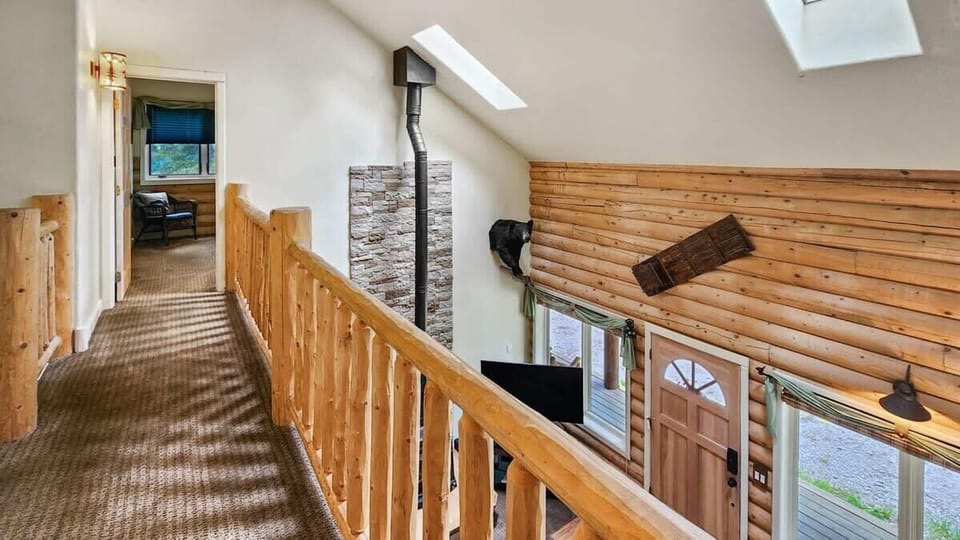 The view from the open upstairs hallway which looks down to the main level.