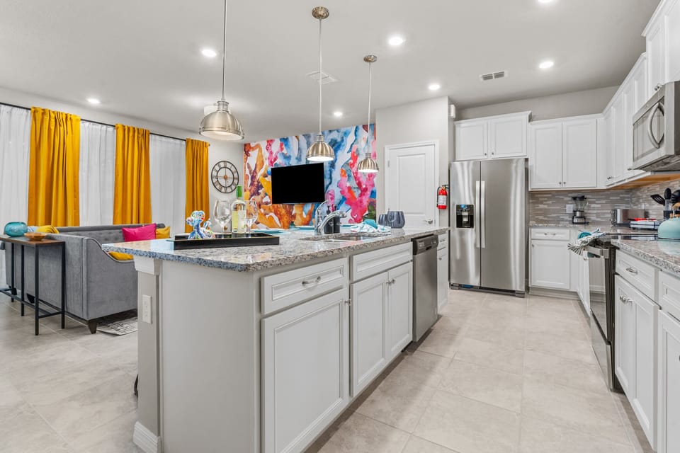 This clean kitchen is well-stocked for your large group.