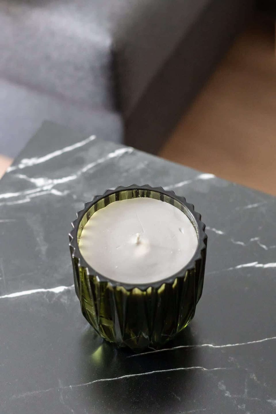 Close-up of a decorative candle adding a cozy and elegant touch to the interior.

