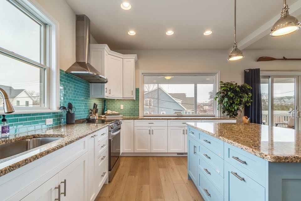 Updated kitchen with Electric stove top and stainless vent hood