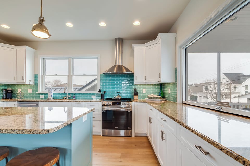 Updated kitchen with Electric stove top and stainless vent hood