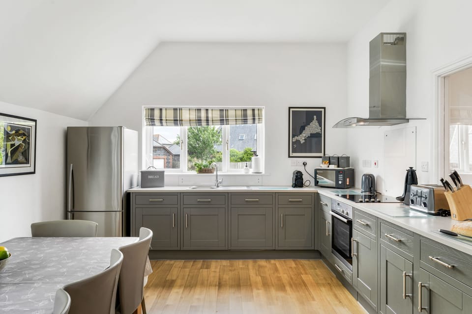 The Hawthorns, Roserrow, First Floor: The well-equipped kitchen/Dining area  with electric oven and hob, fridge/freezer, dishwasher, coffee machine, Smart television and dining for ten guests.