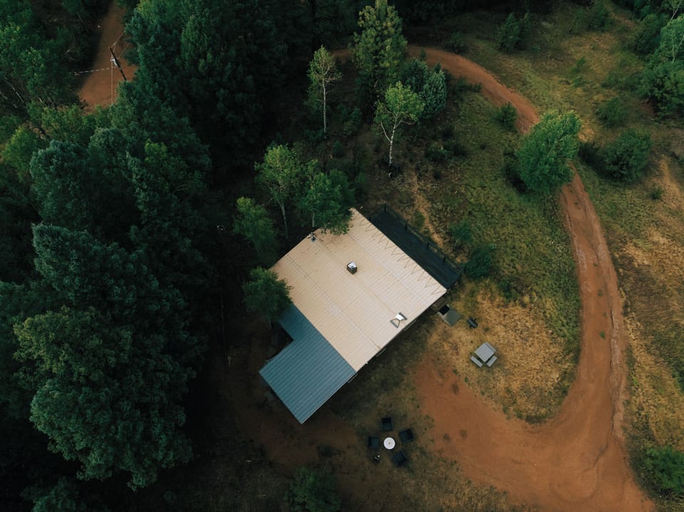 Tucked among the forest with views of the surrounding natural landscape.