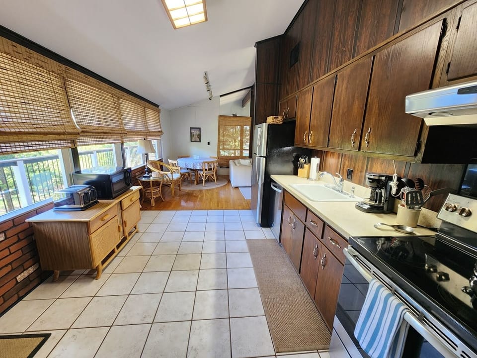 Bright and open kitchen with all the essentials for cooking, dining, and entertaining.