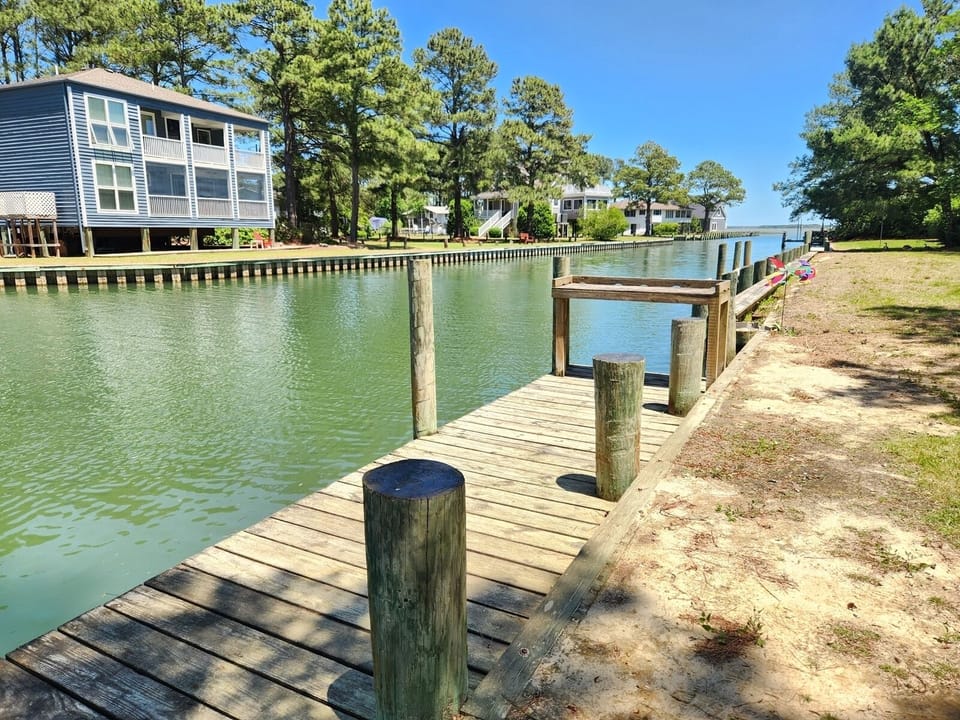 Private dock with direct access for crabbing, boat docking, and kayaking.