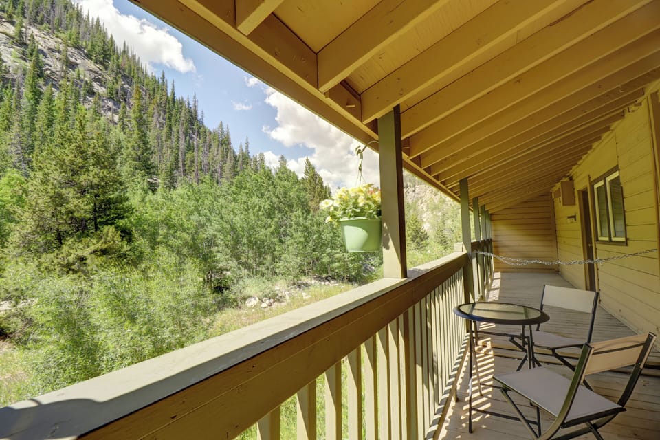 Covered balcony offers great mountain and forested views