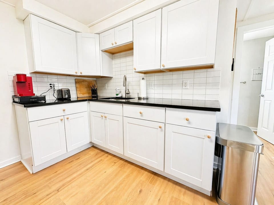Bright modern kitchen with deep sink—easy meal prep and extended stays
