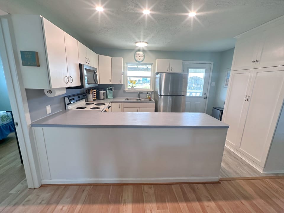 Well-lit kitchen right off the living area