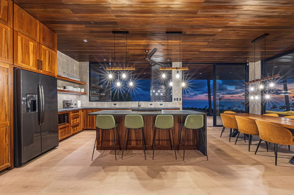 A spacious gourmet kitchen and dining area featuring premium appliances
