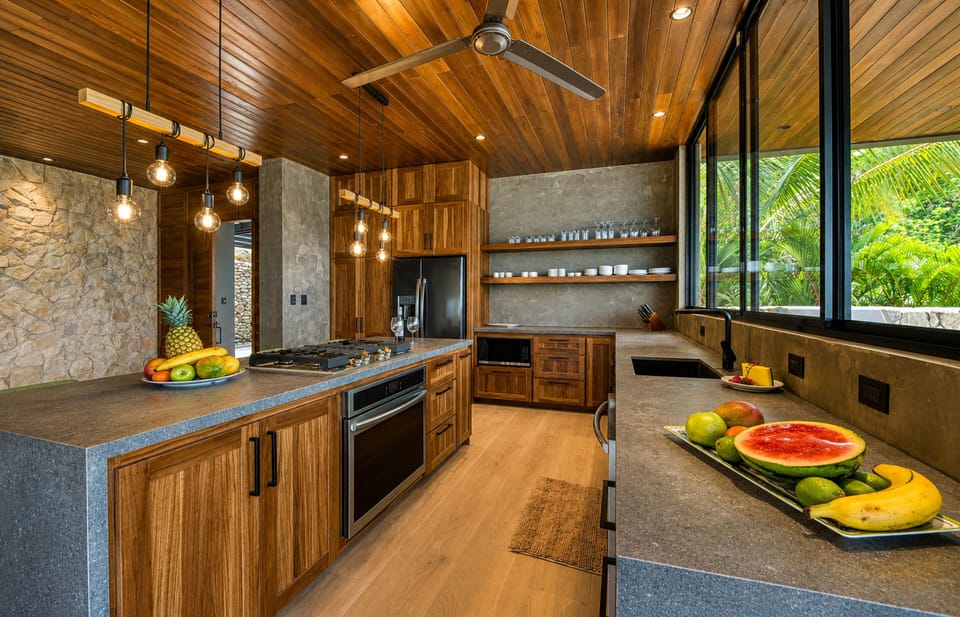 A spacious gourmet kitchen and dining area featuring premium appliances