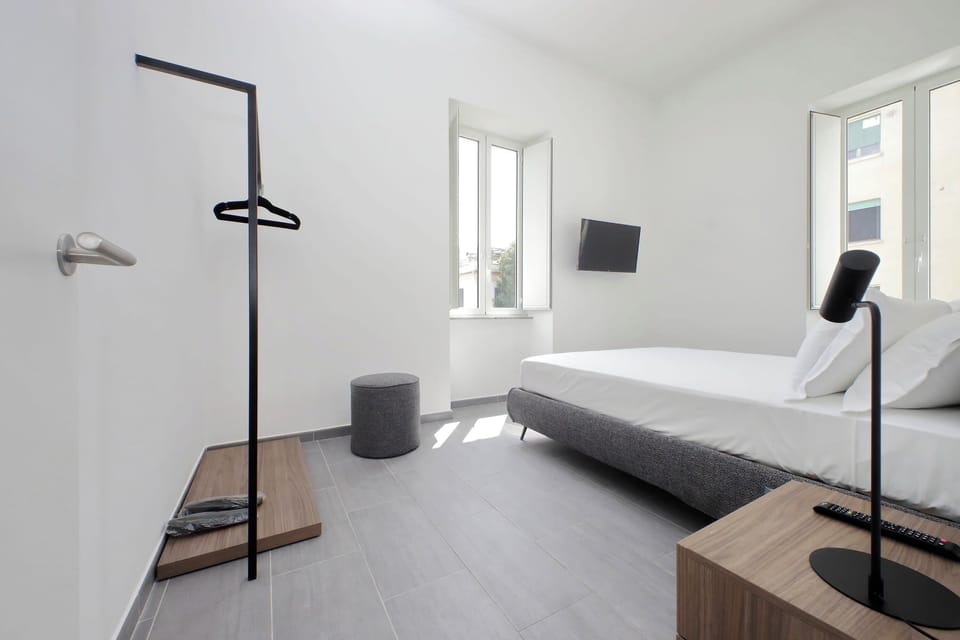 Deluxe Triple Room, 2 Bedrooms | In-room safe, desk, iron/ironing board, WiFi (free)