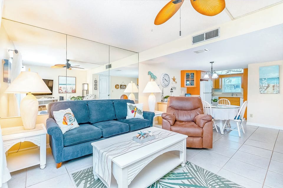 Spacious and inviting living area with cozy furniture and a coastal-inspired design.