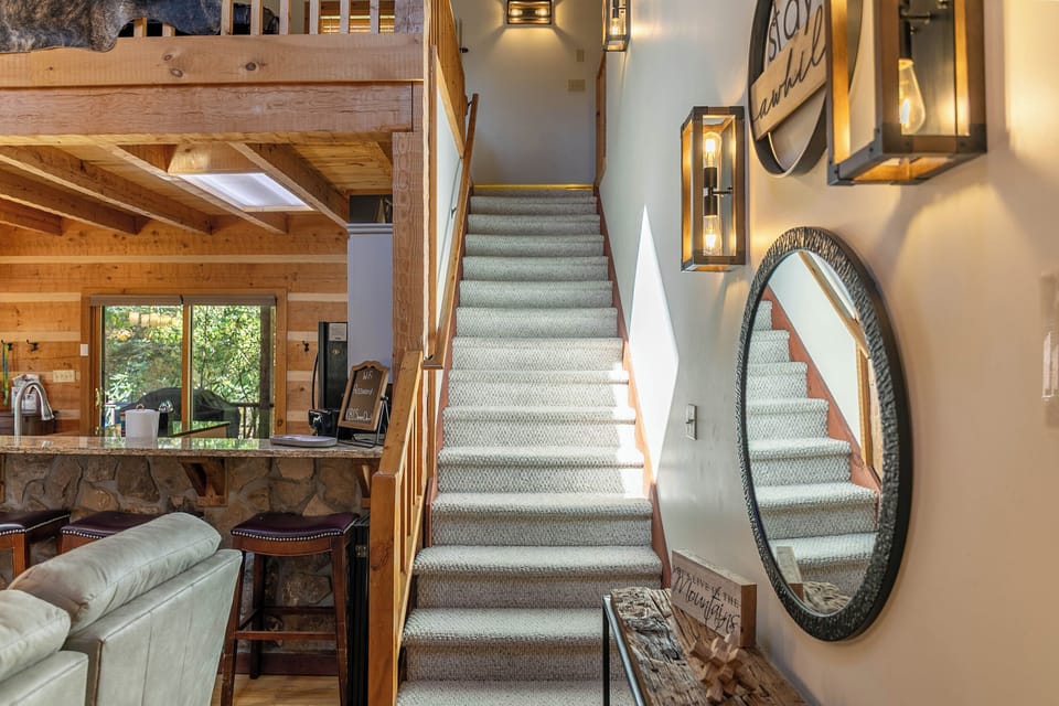 Staircase to the loft area- king bedroom, pool table, & work space