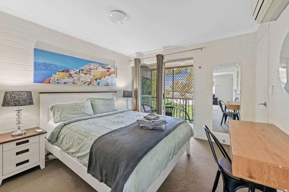 The air-conditioned bedroom opens onto your private balcony