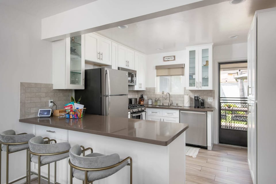 A freshly renovated kitchen is stocked with all high-quality essentials.