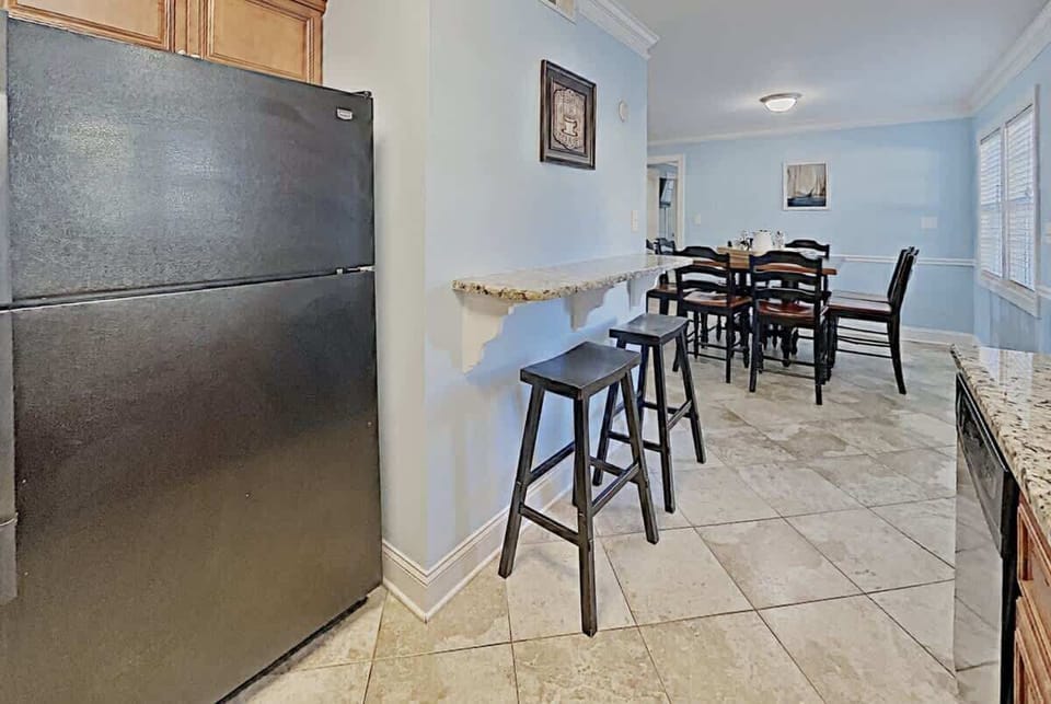 Coastal touches and practical space make this a dream for beachside cooking.

