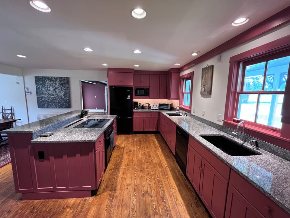 Fully stocked kitchen with two sinks and full set of appliances