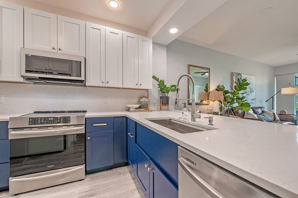 Pristine, modern, completely renovated kitchen, opens to the private golf view!