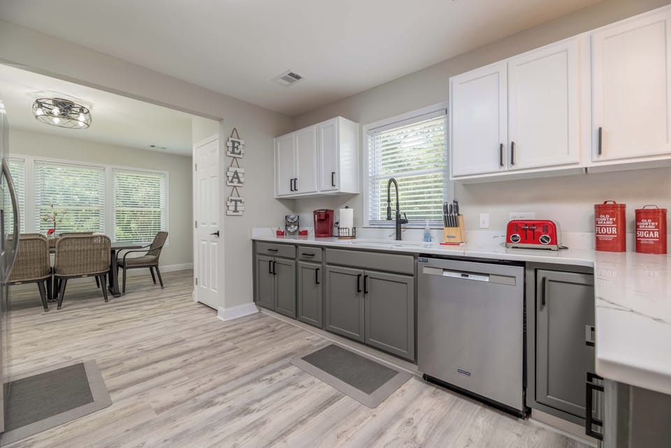 Open kitchen leads right into the dining room with seating for 6. 