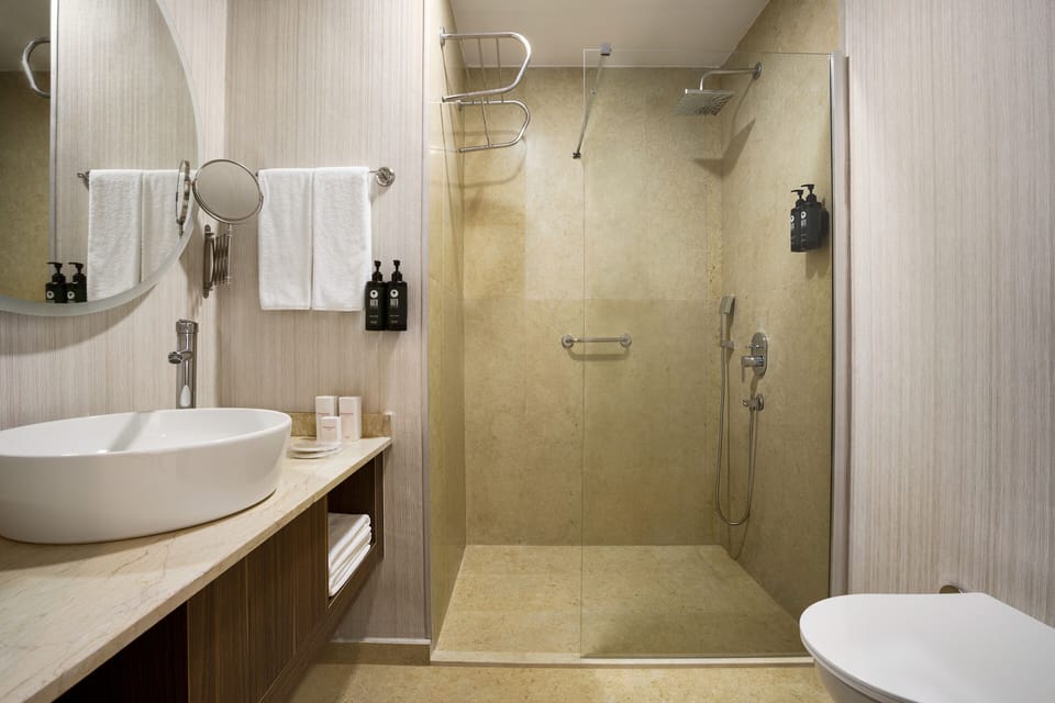 Shower, free toiletries, hair dryer, slippers