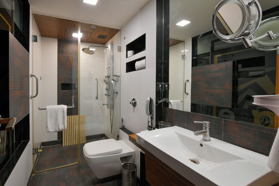 Premium Double Room, 1 King Bed | Bathroom | Separate tub and shower, hydromassage showerhead, designer toiletries