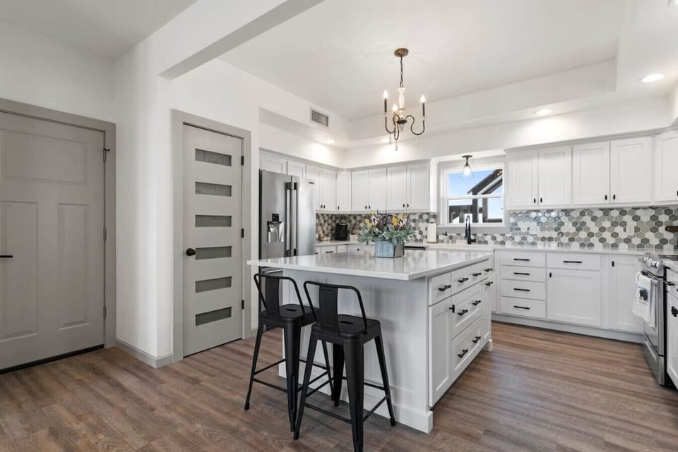 Full pantry, tile backsplash, and kitchen utensils are all here - perfect for gatherings, holidays and events!
