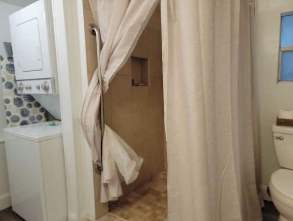 Bathroom with Laundry, Walk-in Shower and New Elongated Toilet