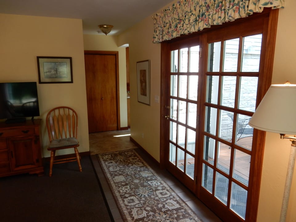 Main entrance on the deck to the dining room, extra living room.
