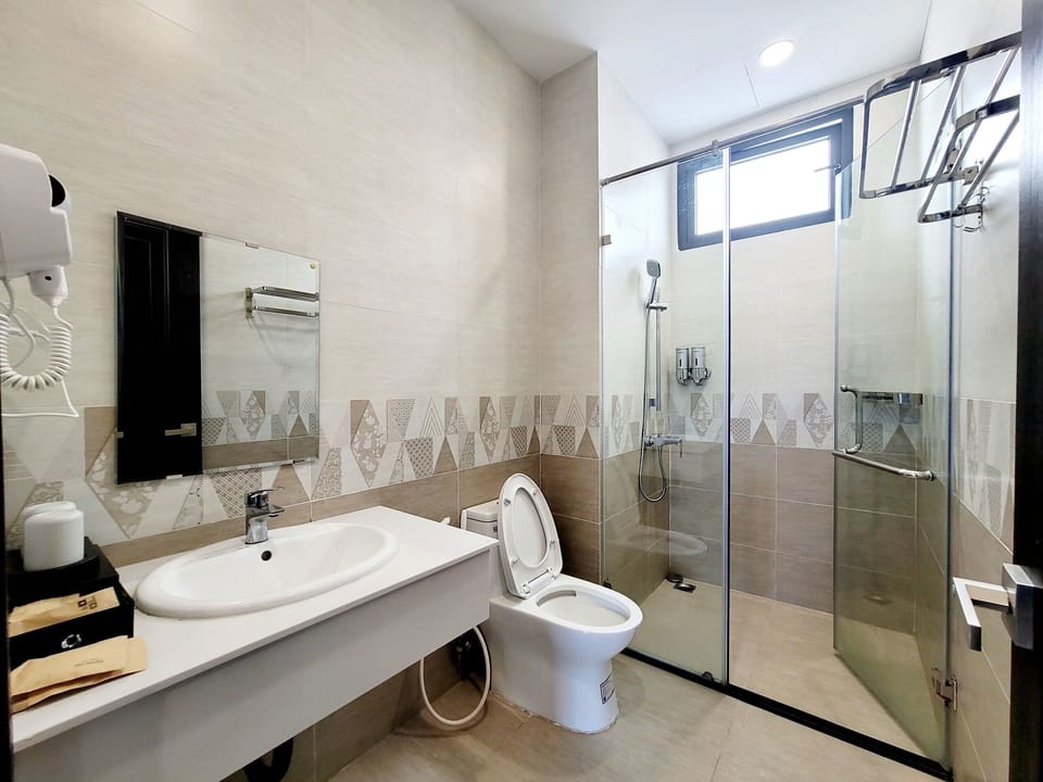 Shower, rainfall showerhead, designer toiletries, hair dryer