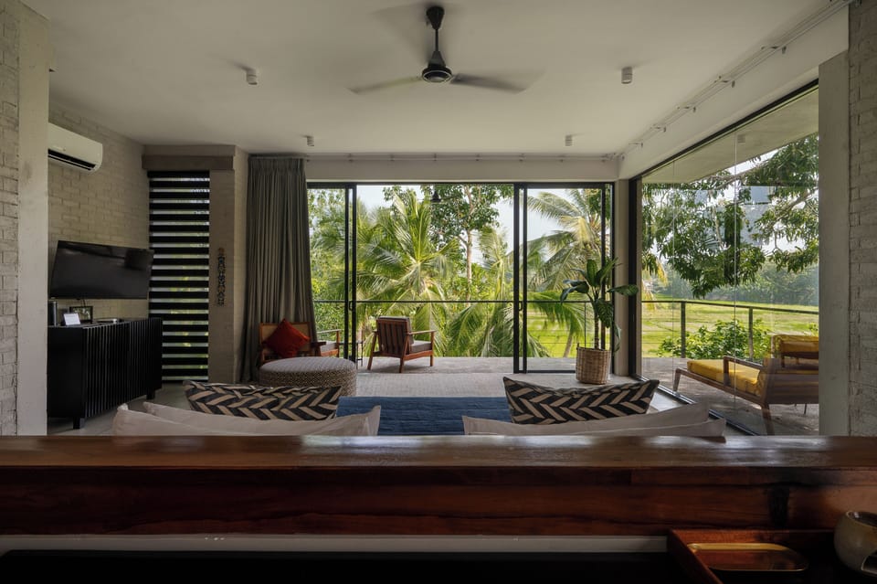 Premier King Suite | Living area | 42-inch flat-screen TV with cable channels, TV