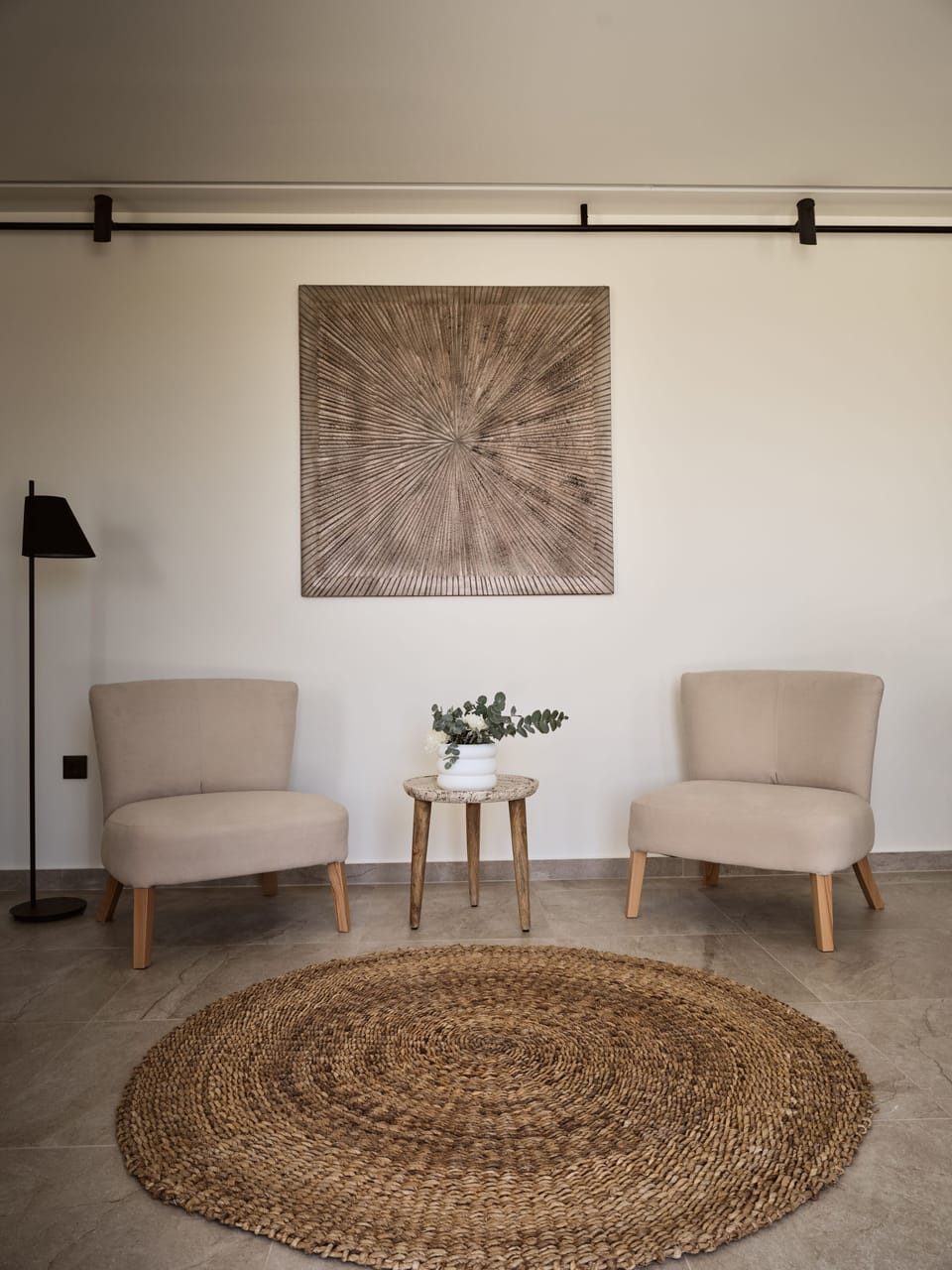 The living room is bright and filled with natural materials