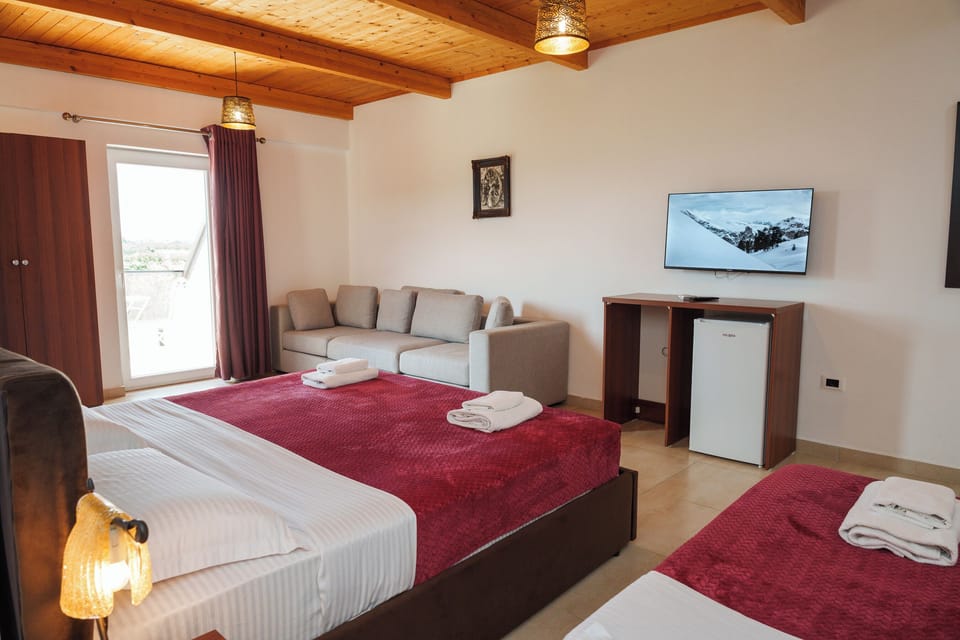 Family Triple Room, Balcony | Desk, laptop workspace, blackout drapes, cribs (free)