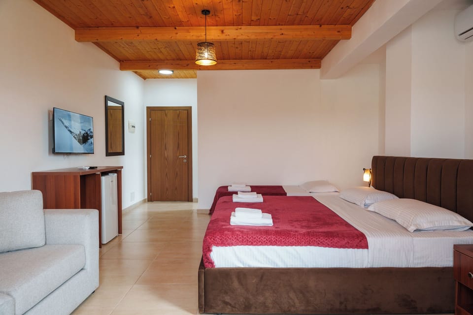Family Triple Room, Balcony | Desk, laptop workspace, blackout drapes, cribs (free)