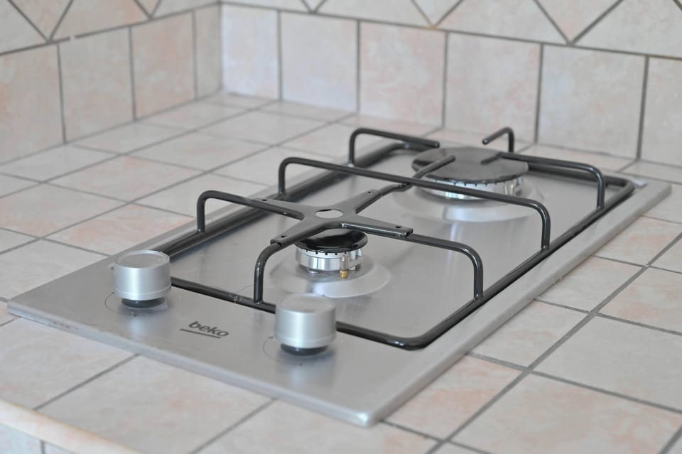 Classic Apartment | Private kitchen | Cookware/dishes/utensils, dining table
