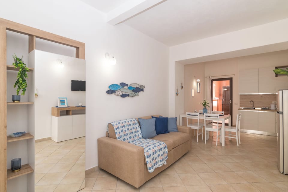 Family Apartment, 2 Bedrooms, Balcony (Appartamento Mirto In The City Center) | Living area | TV