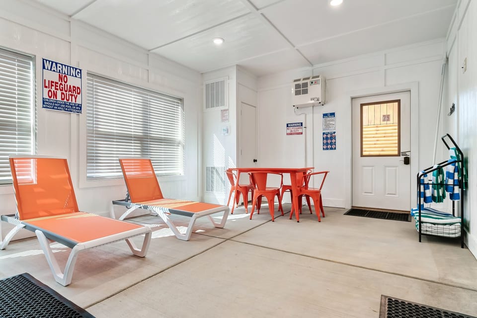 Poolside Lounge: Bright orange chairs and a sunny vibe invite you to relax after a splash!