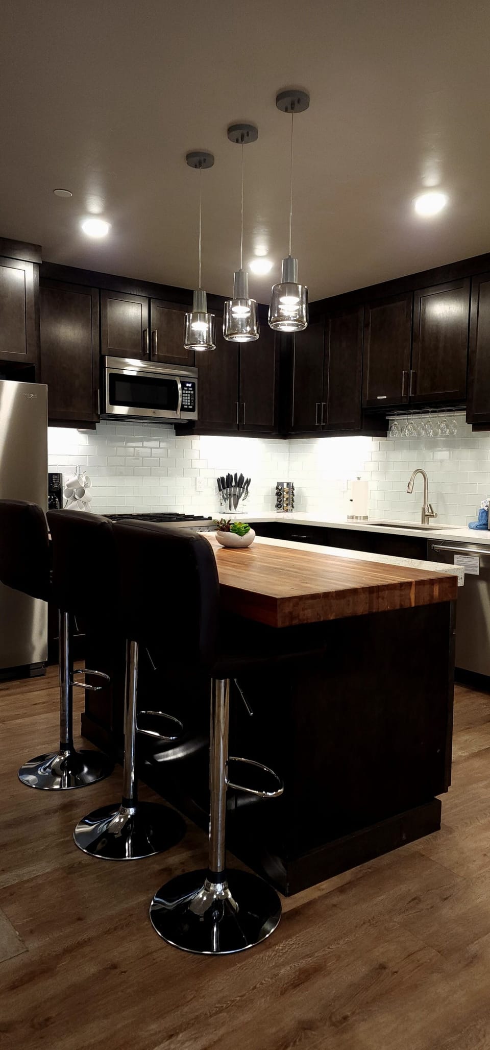Beautiful kitchen with appliances, cookware, and things you need to dine in.