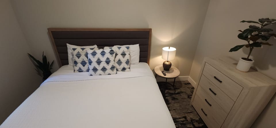 The charming third bedroom provides a king bed.