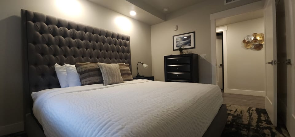 The inviting third bedroom provides a high end king bed for a great nights sleep.