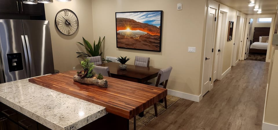Plenty of seating is available at mealtimes at the dining table and kitchen island.