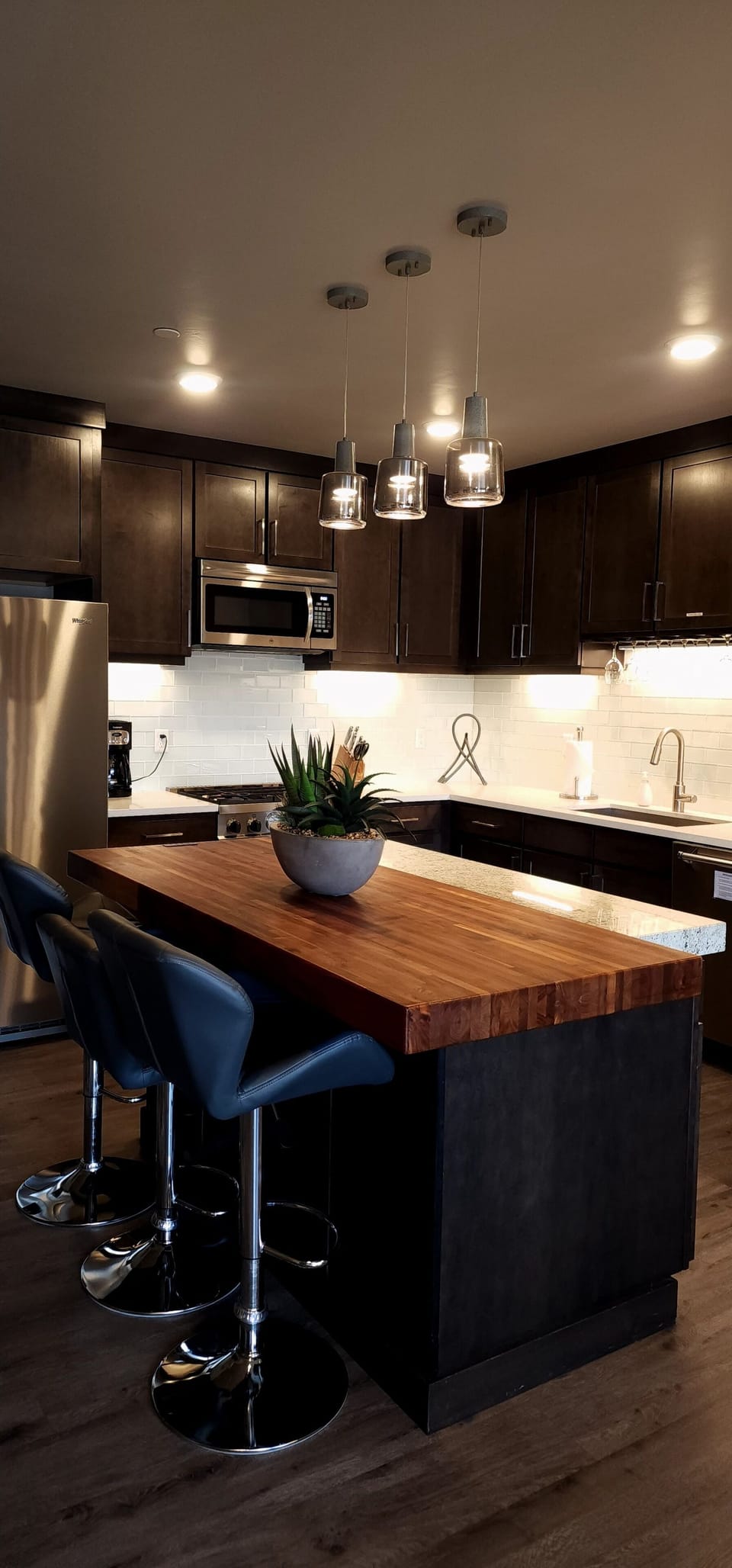 The gorgeous kitchen features granite countertops, stainless steel appliances, and everything you'll need to whip up a tasty meal.