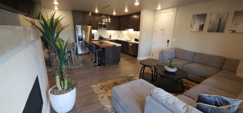 The living area opens seamlessly to the luxury kitchen.